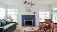 Sitting room with central fireplace using Ann Sacks tile, surrounded by Kolbe wood windows